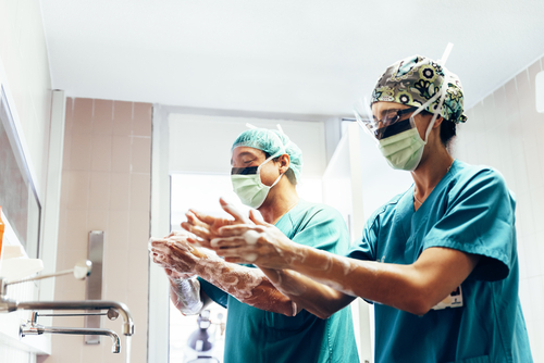 Two doctors washing their hands before a medical procedure