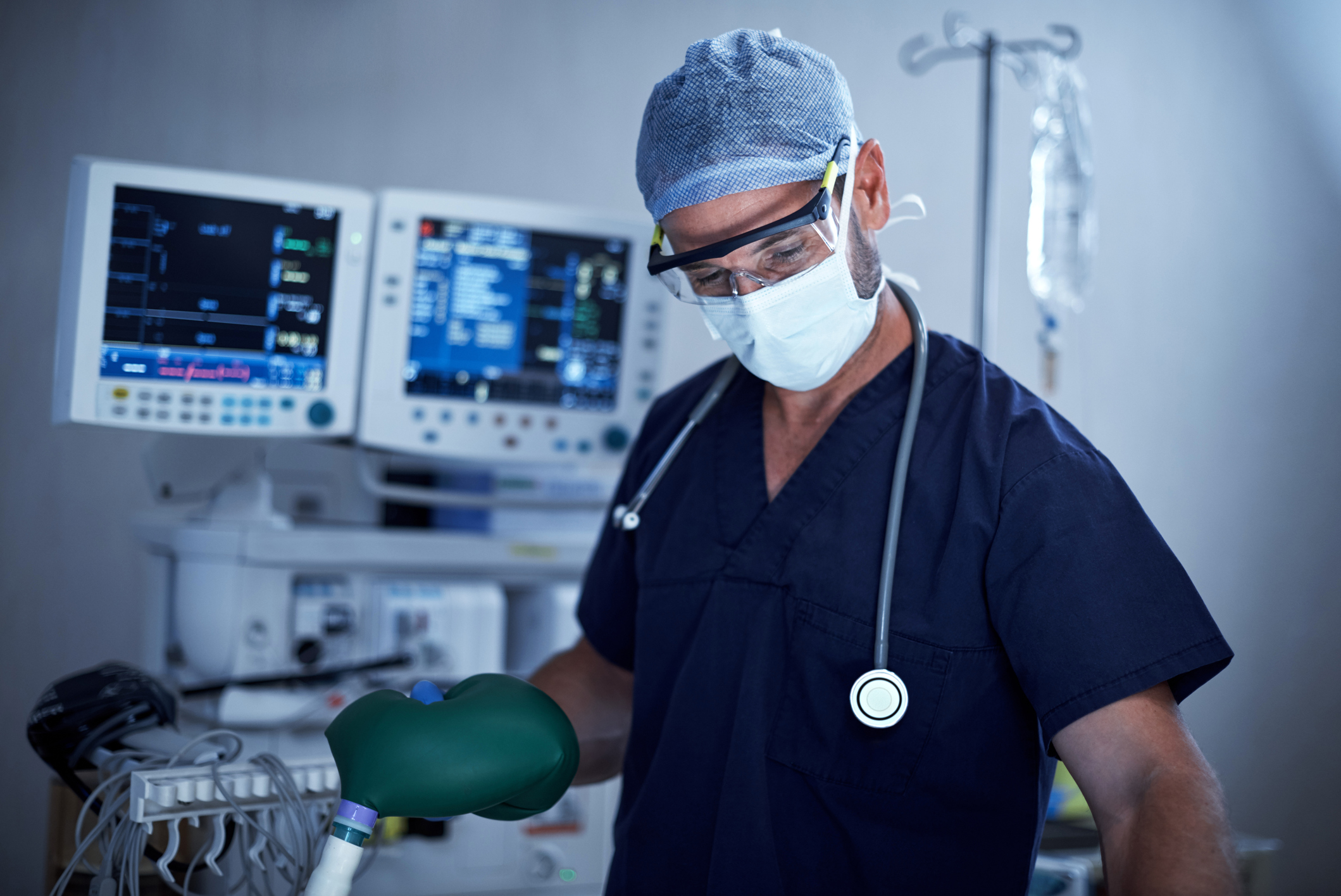 An anesthesiologist administering anesthesia to a patient before surgery