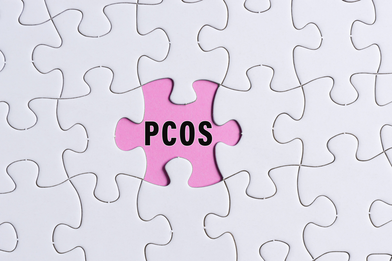 Jigsaw puzzle with pink space that says PCOS
