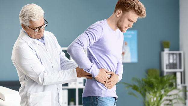 A nephrologist examining a patient’s kidneys for kidney diseases