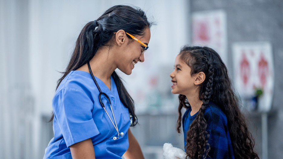 Summit Health pediatrician examining a child with joint pain concerns in a friendly medical office setting