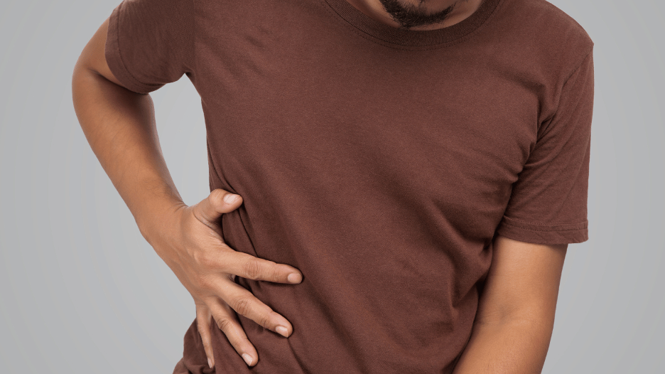 Man experiencing severe gallbladder pain in the upper abdomen