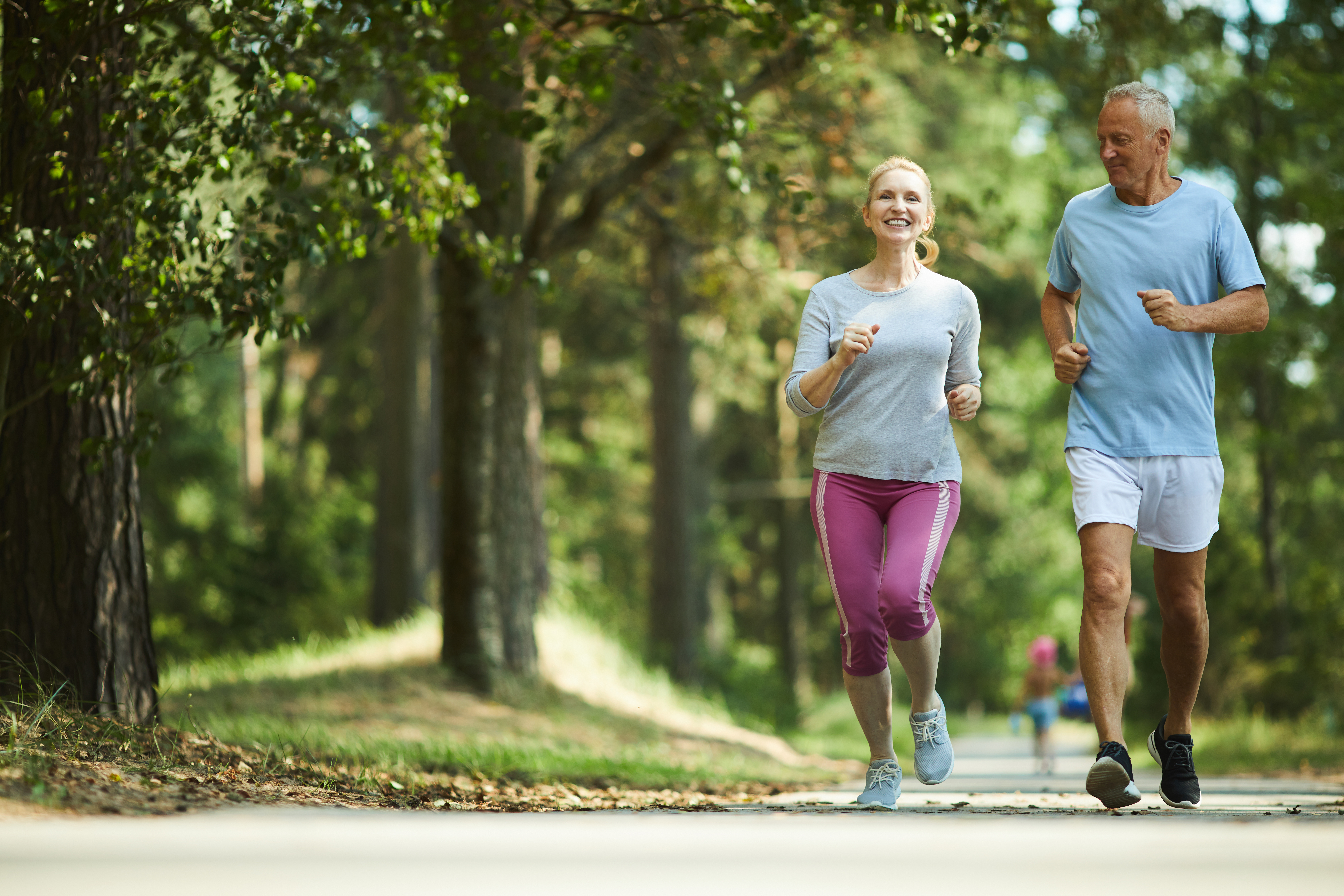 Older adults jogging outside together to support joint health, mobility and active aging