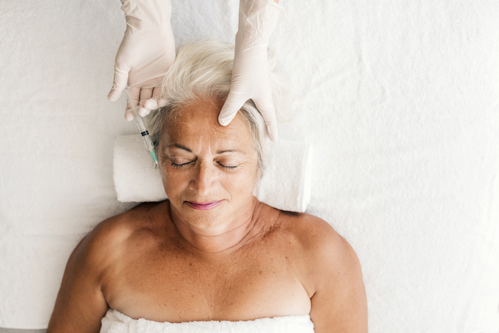 Older woman after Botox and brow lift procedures 