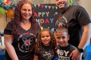 Family of four celebrating a child's birthday