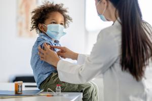 Child receiving COVID-19 vaccine