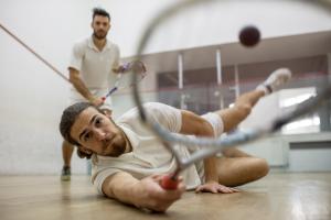 Two people playing squash.