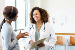 Female doctor speaking with a patient in the office