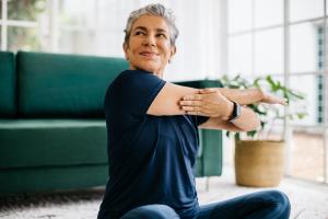 woman stretching indoors