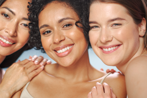 three women smiling for a photo