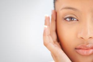 Close up of a woman holding her face
