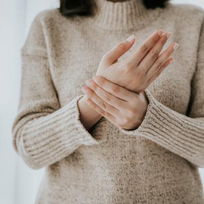 woman holding her wrist