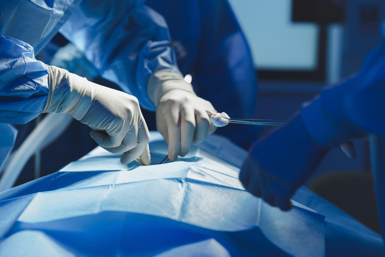 gloved hands in an ambulatory surgery room