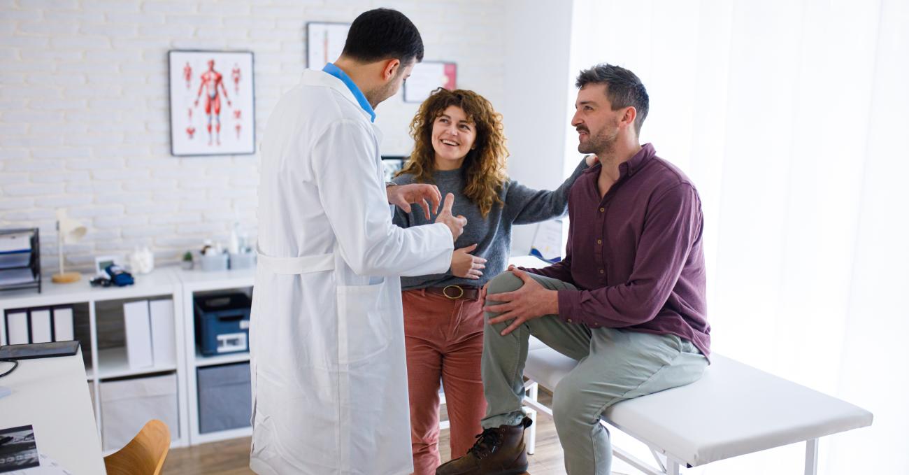 man and woman at doctor's office